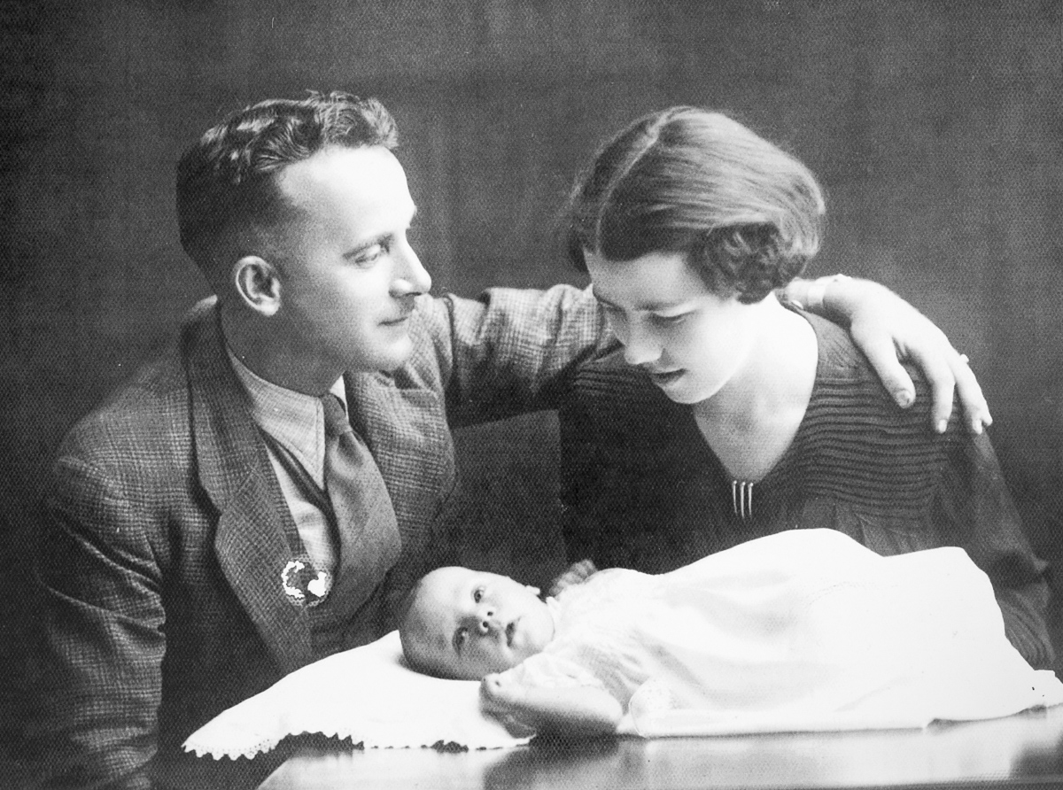 A picture of baby David Leon Baker with his mother and father.